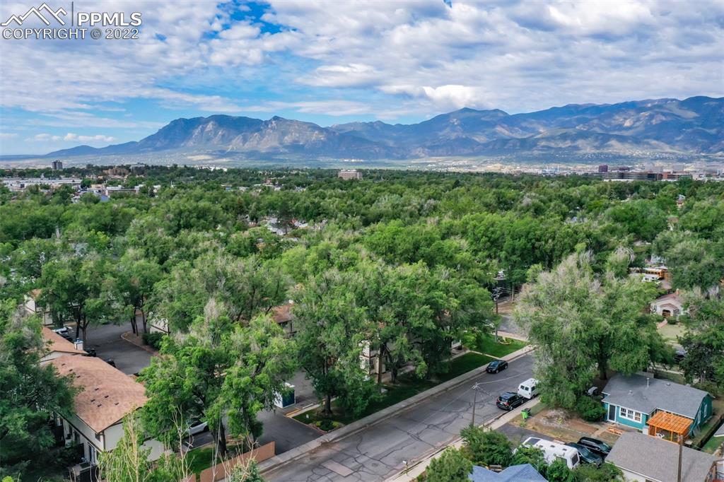 789 Alexander Road, Unit D Colorado Springs, CO 80909 - Photo 35 of 36 an aerial view of a house with a yard