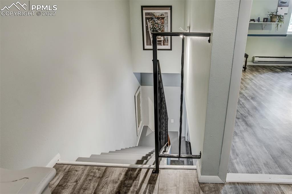 789 Alexander Road, Unit D Colorado Springs, CO 80909 - Photo 5 of 36 a view of a gallery with wooden floor
