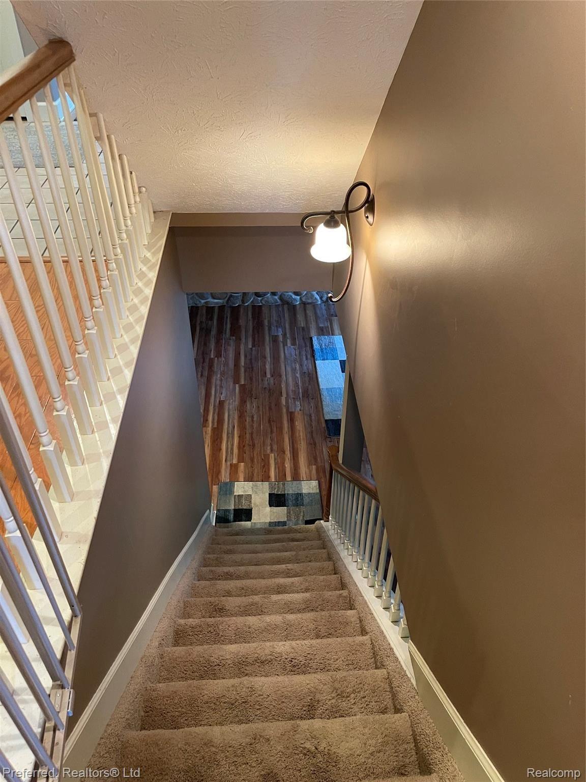 1974 Sexton Road Howell, MI 48843 - Photo 17 of 49 Stairs to Finished Walk out Lower level
