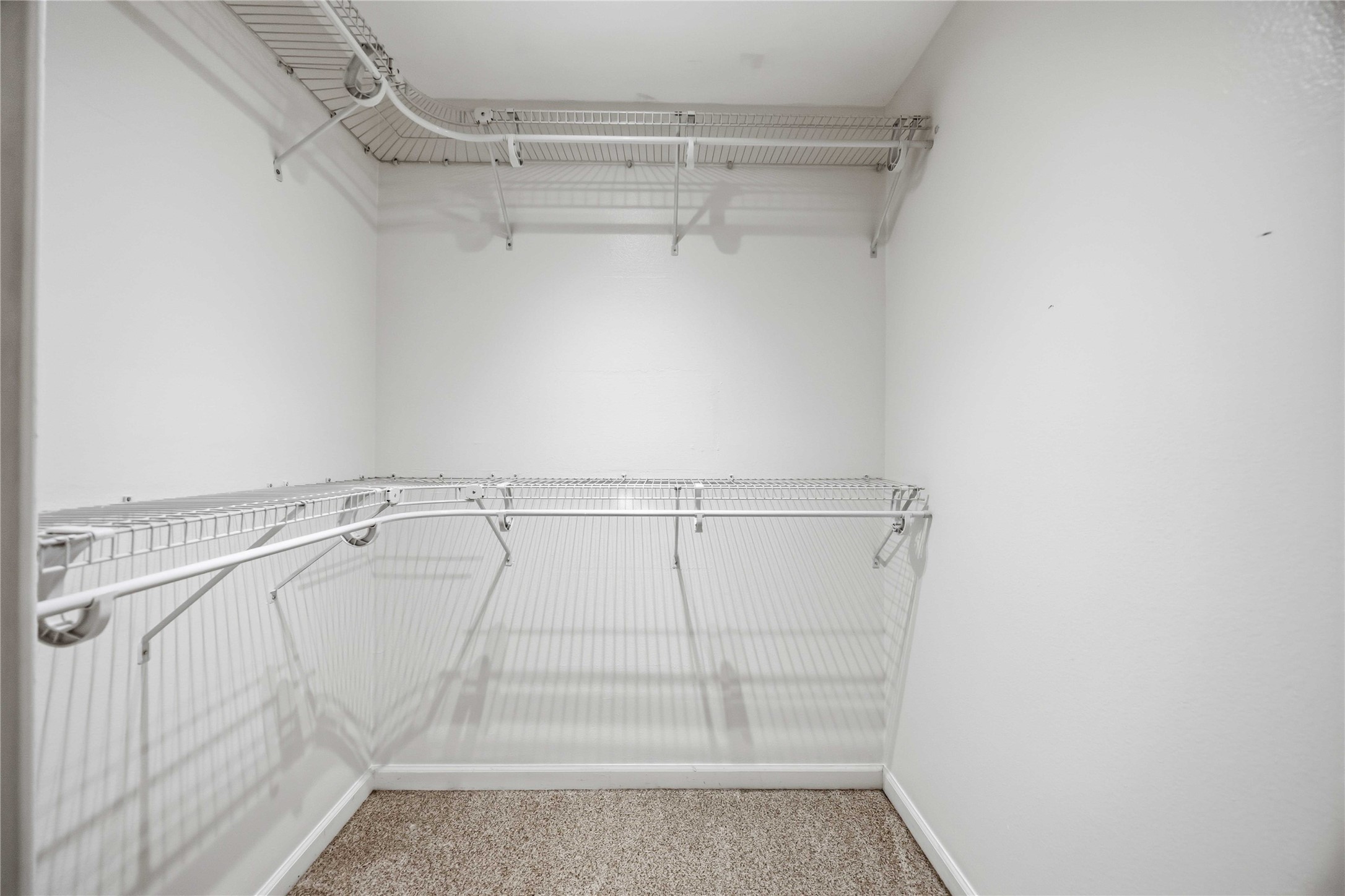 2100 Commonwealth Street, Unit C Houston, TX 77006 - Photo 14 of 25 a view of walk in closet with empty racks