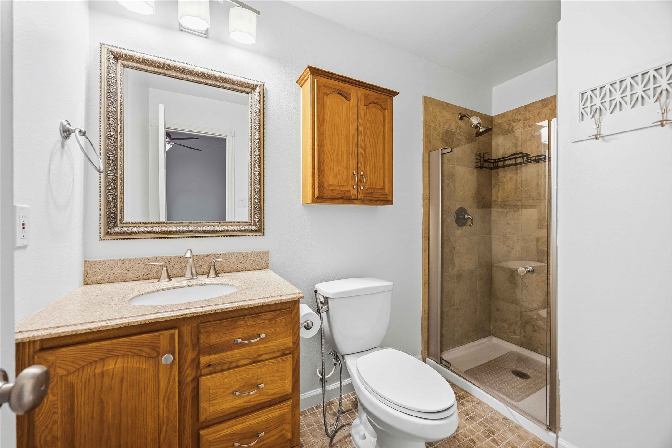 2100 Commonwealth Street, Unit C Houston, TX 77006 - Photo 22 of 25 a bathroom with a sink a toilet and shower