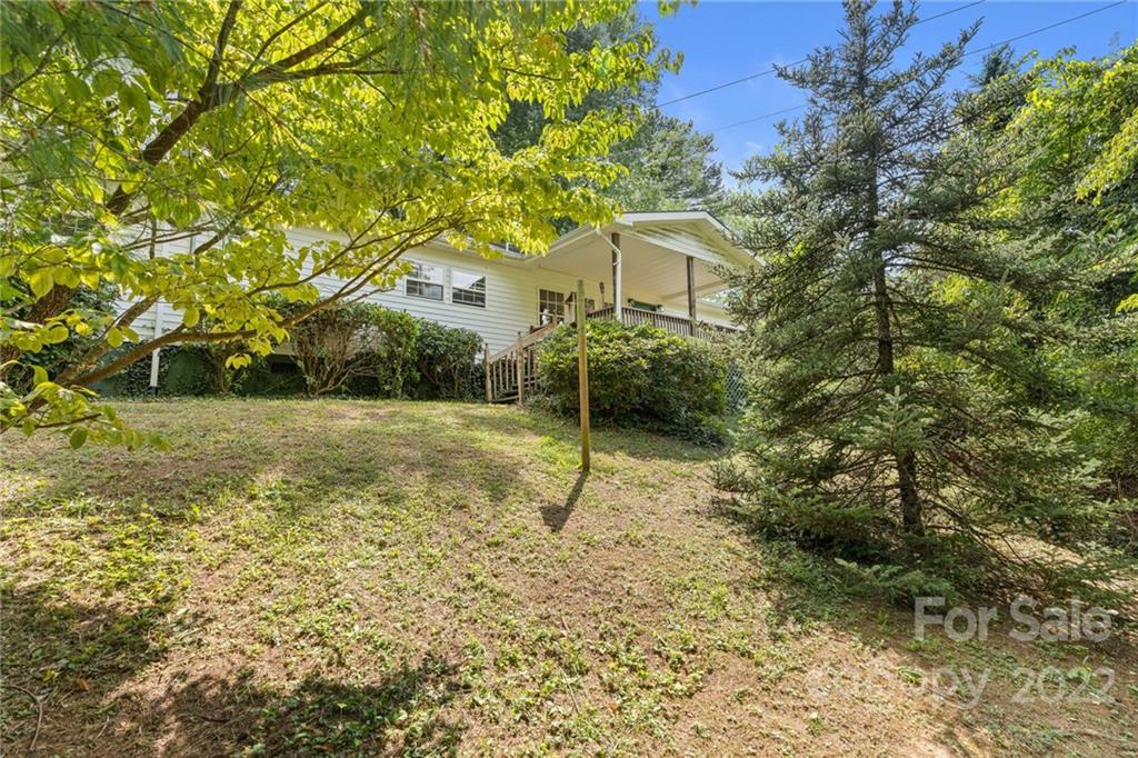a house view with a backyard space