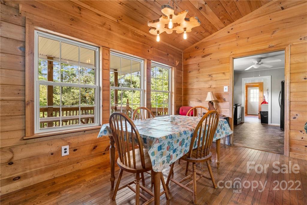 44 Jessella Drive Clyde, NC 28721 - Photo 11 of 37 a view of a dining room with furniture window and outside view