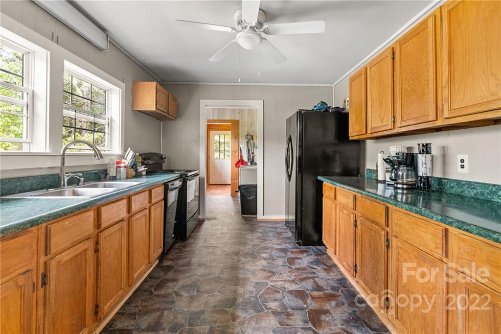 44 Jessella Drive Clyde, NC 28721 - Photo 13 of 37 a large kitchen with stainless steel appliances granite countertop a refrigerator and a sink