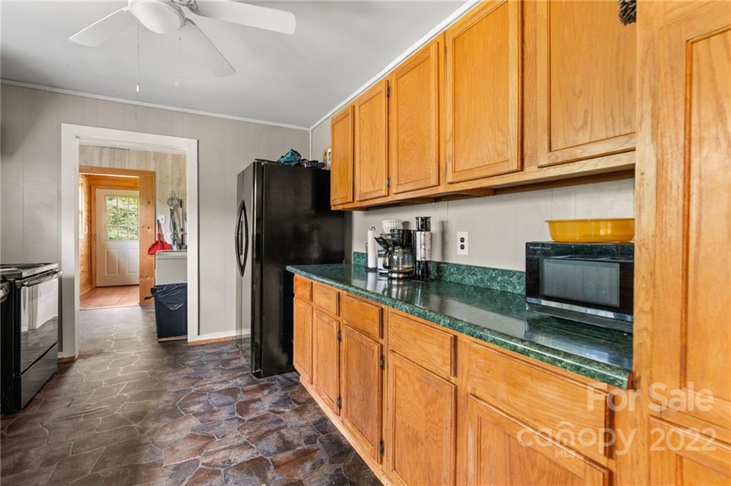 44 Jessella Drive Clyde, NC 28721 - Photo 14 of 37 a kitchen with stainless steel appliances granite countertop a refrigerator and a sink