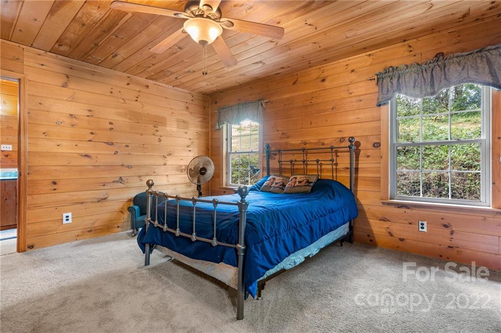 44 Jessella Drive Clyde, NC 28721 - Photo 17 of 37 a bedroom with a bed and window