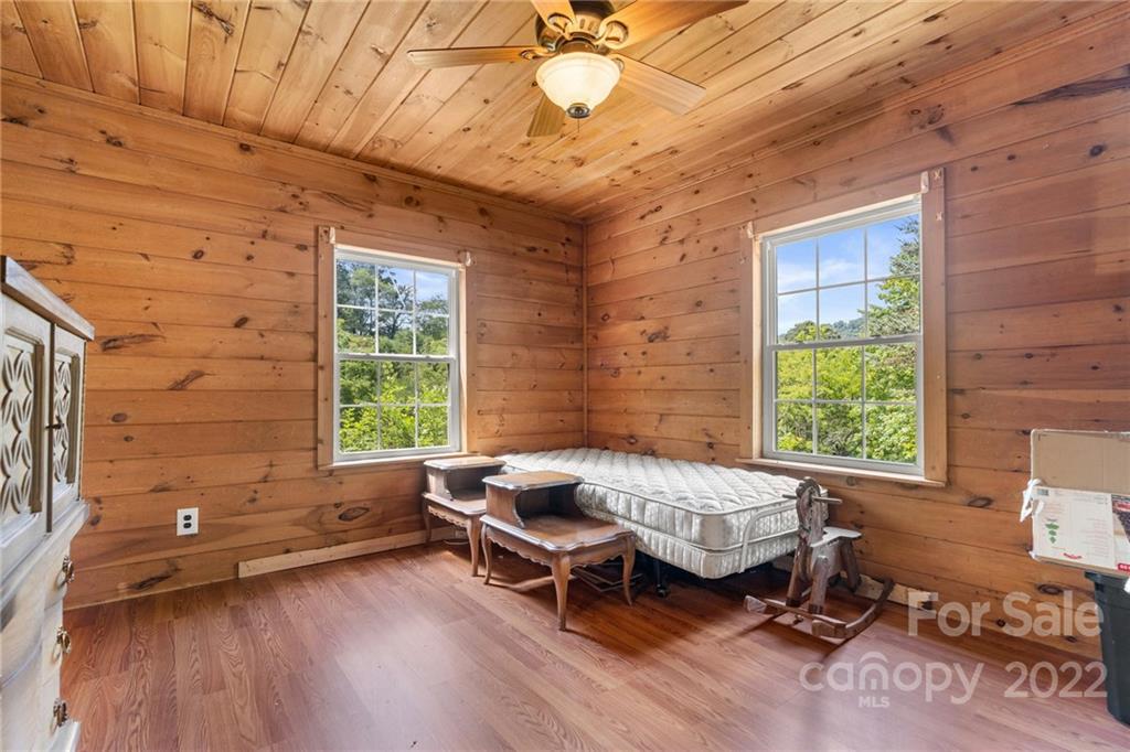 44 Jessella Drive Clyde, NC 28721 - Photo 21 of 37 a bedroom with furniture and a window