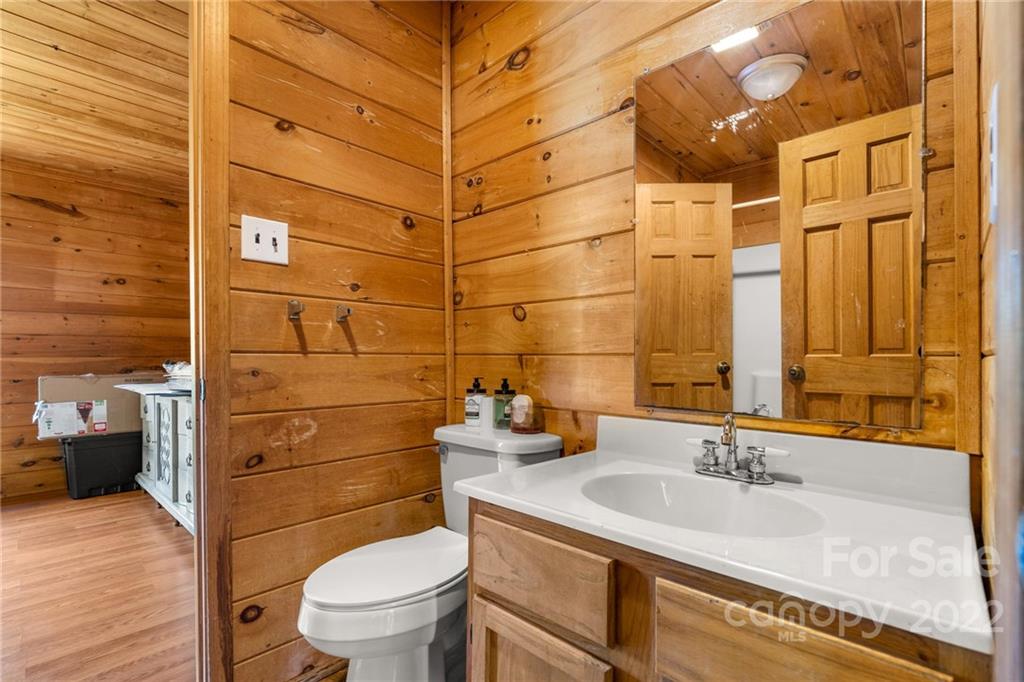 44 Jessella Drive Clyde, NC 28721 - Photo 23 of 37 a bathroom with a sink a toilet and shower