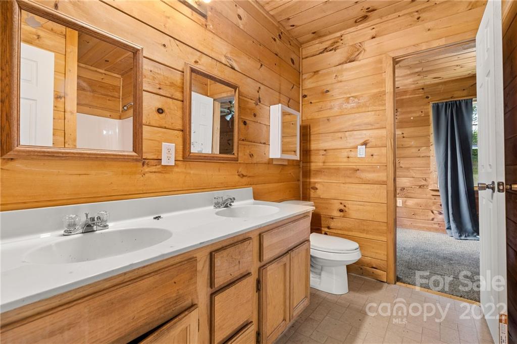 44 Jessella Drive Clyde, NC 28721 - Photo 29 of 37 a bathroom with a sink a toilet and shower