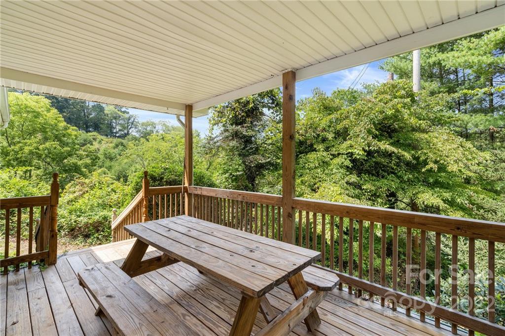 44 Jessella Drive Clyde, NC 28721 - Photo 35 of 37 a view of a wooden deck with furniture