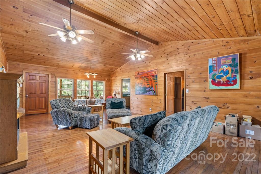44 Jessella Drive Clyde, NC 28721 - Photo 9 of 37 a living room with furniture and a flat screen tv