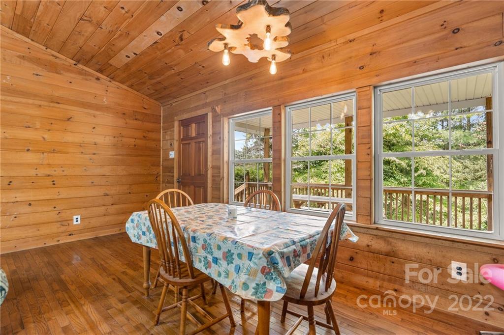 44 Jessella Drive Clyde, NC 28721 - Photo 10 of 37 a view of a dining room with furniture window and outside view