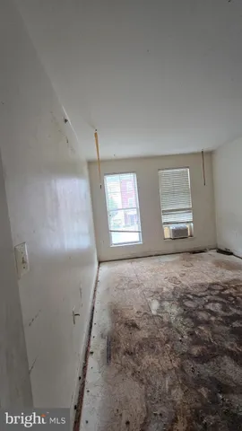 a view of empty room with windows