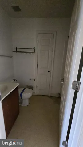 a bathroom with a toilet and a sink
