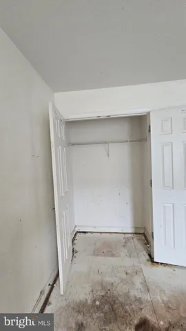 an empty room with a bench