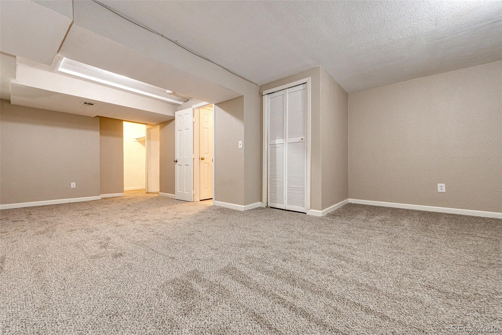 18538 East Whitaker Circle, Unit E Aurora, CO 80015 - Photo 23 of 31 a view of an empty room and window