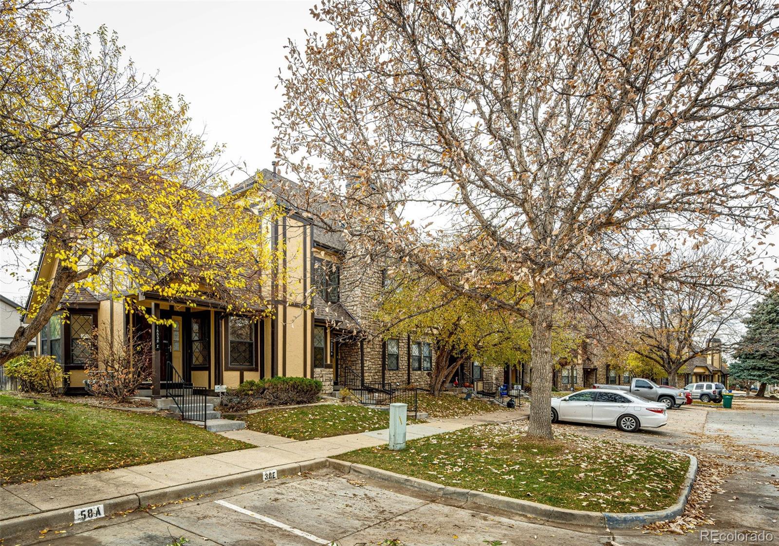 18538 East Whitaker Circle, Unit E Aurora, CO 80015 - Photo 3 of 31 a view of a house with a yard and pathway
