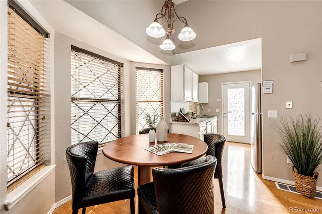 a view of a dining room with furniture window and wooden floor