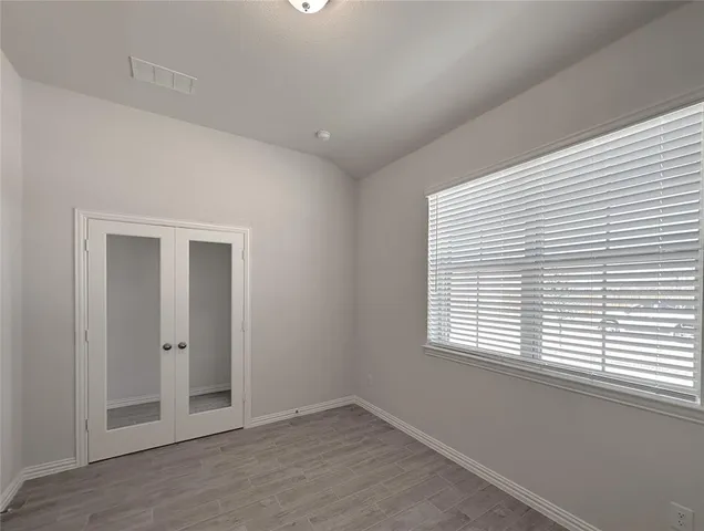 an empty room with windows