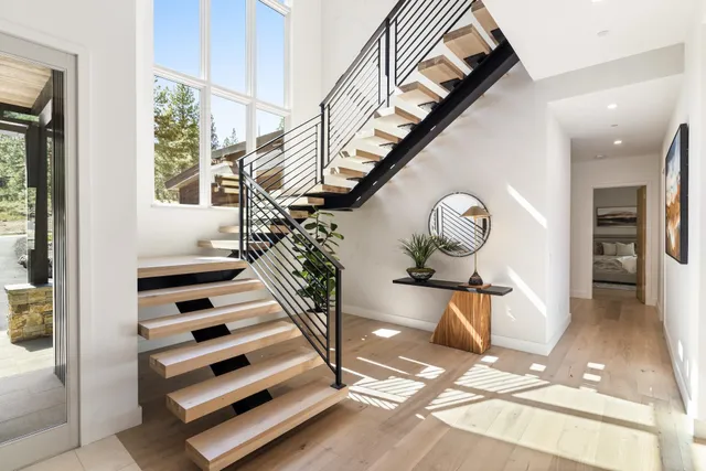 a view of entryway and hall with wooden floor