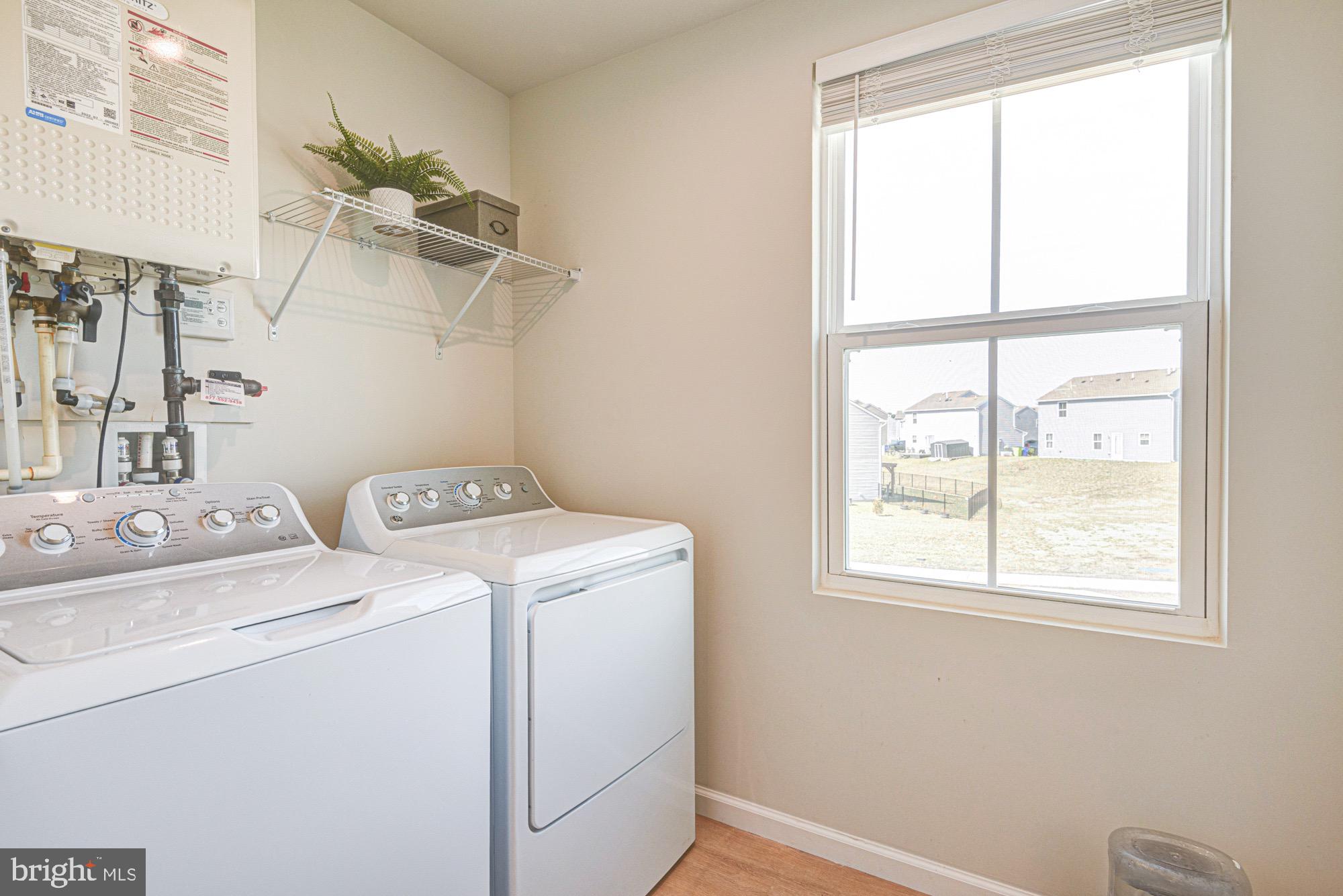 293 Sedimentary Rock Road Dover, DE 19904 - Photo 36 of 36 a utility room with dryer and washer