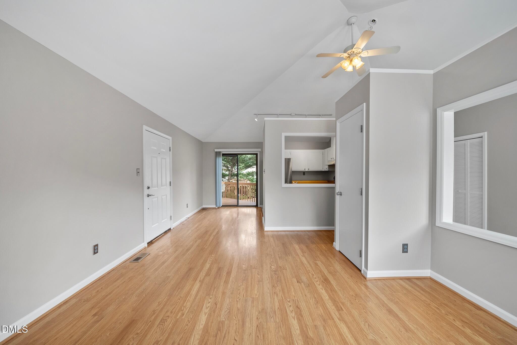 3634 Mill Run Raleigh, NC 27612 - Photo 7 of 18 wooden floor in an empty room with a window