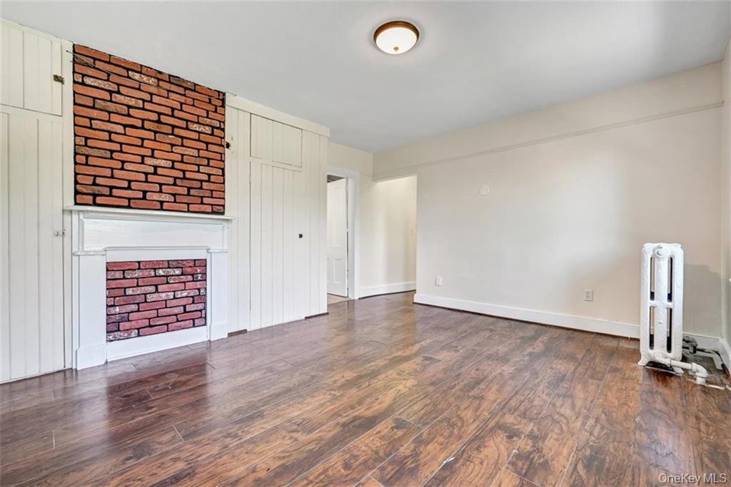 7 Schunnemunk Road Highland Mills, NY 10930 - Photo 12 of 27 a view of an empty room with a window and wooden floor