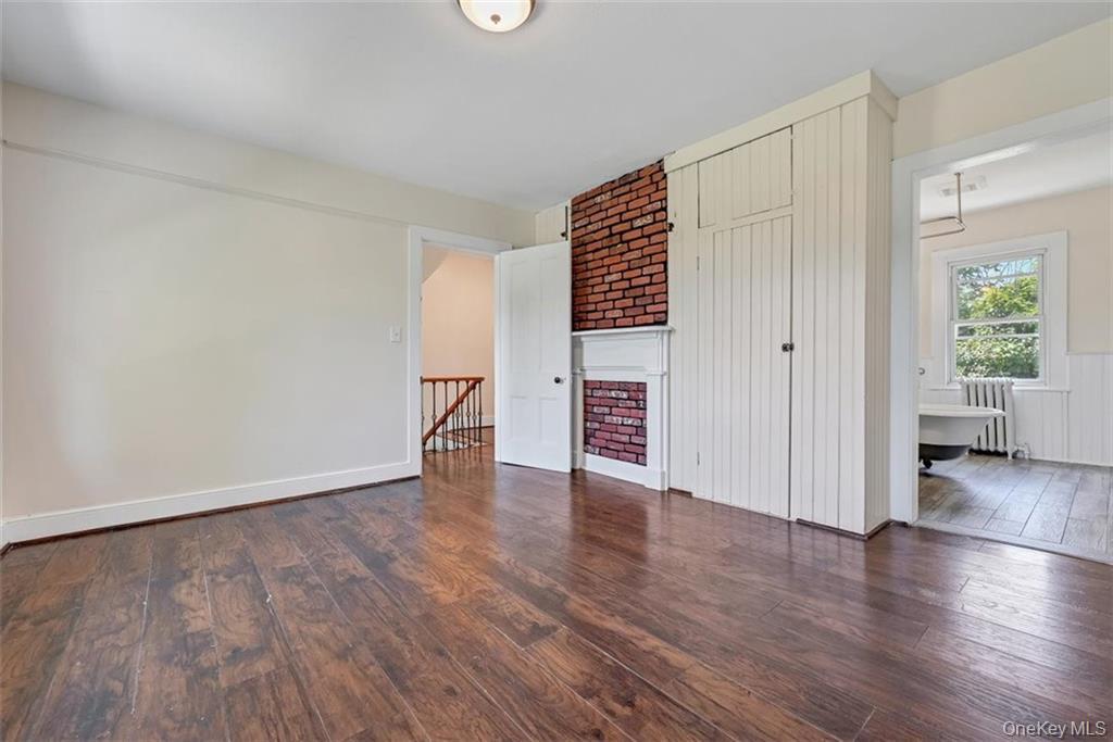 7 Schunnemunk Road Highland Mills, NY 10930 - Photo 13 of 27 an empty room with wooden floor and windows