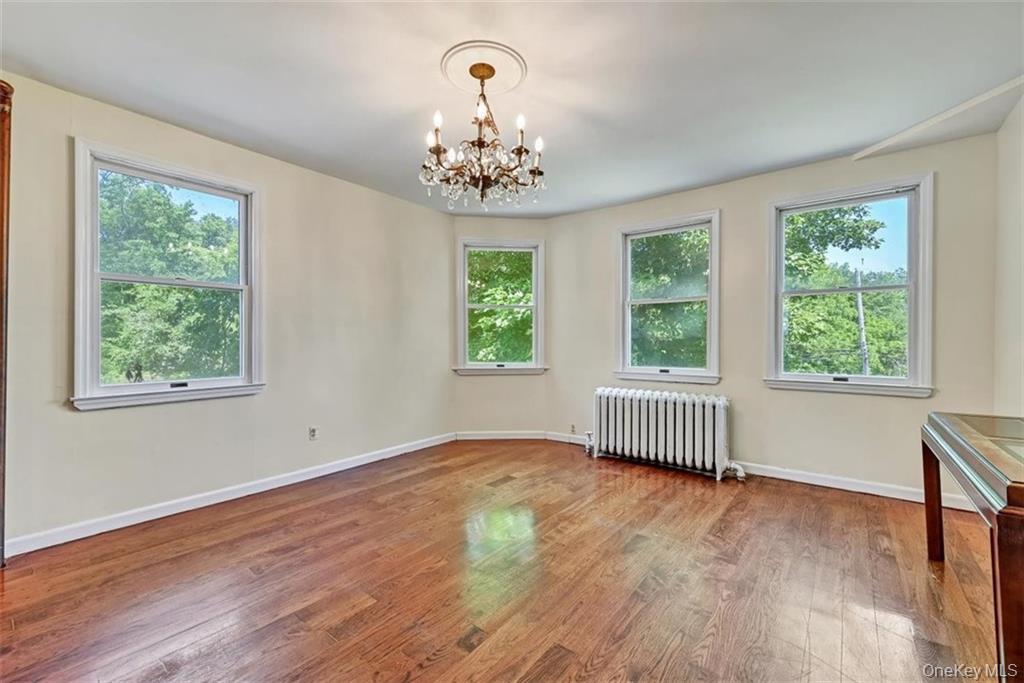 7 Schunnemunk Road Highland Mills, NY 10930 - Photo 14 of 27 a view of an empty room with wooden floor and a window