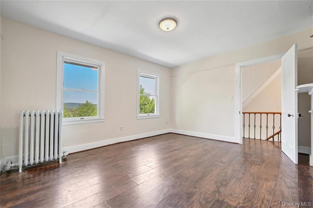 7 Schunnemunk Road Highland Mills, NY 10930 - Photo 15 of 27 an empty room with wooden floor and windows