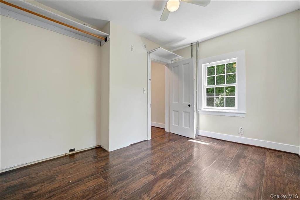7 Schunnemunk Road Highland Mills, NY 10930 - Photo 17 of 27 an empty room with wooden floor and windows
