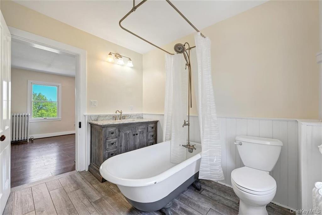 7 Schunnemunk Road Highland Mills, NY 10930 - Photo 18 of 27 a bathroom with a toilet a sink and a bathtub