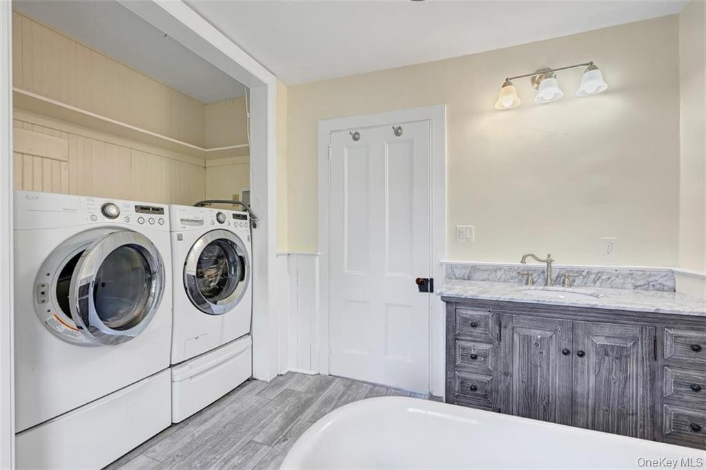 7 Schunnemunk Road Highland Mills, NY 10930 - Photo 19 of 27 a bedroom with a sink and a washer dryer