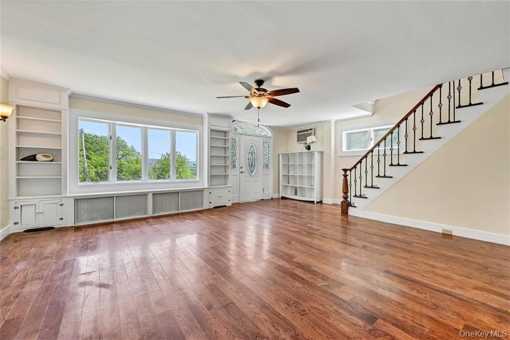 7 Schunnemunk Road Highland Mills, NY 10930 - Photo 4 of 27 a view of an empty room with wooden floor and a window