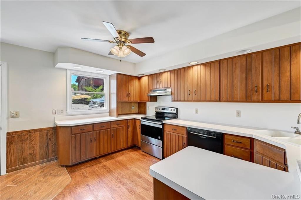 7 Schunnemunk Road Highland Mills, NY 10930 - Photo 6 of 27 a kitchen with stainless steel appliances kitchen island granite countertop a sink dishwasher stove and cabinets with wooden floor