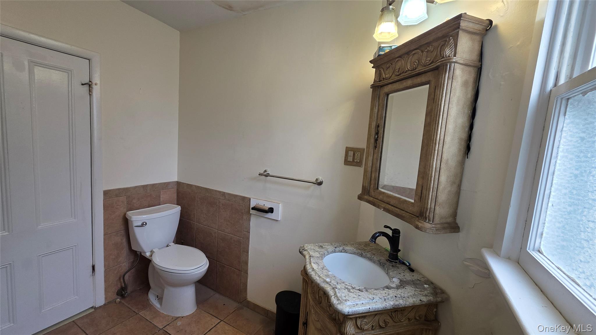 7 Schunnemunk Road Highland Mills, NY 10930 - Photo 9 of 27 a bathroom with a toilet sink and mirror