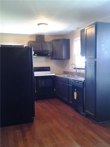 1746 West Grab Creek Road Dickson, TN 37055 - Photo 12 of 20 Kitchen has NEW Cabinets, Counter tops, Dish Washer and Almost New Refrigerator. The Seller has added Crown Molding in the Dining Room & Kitchen for a richer effect.