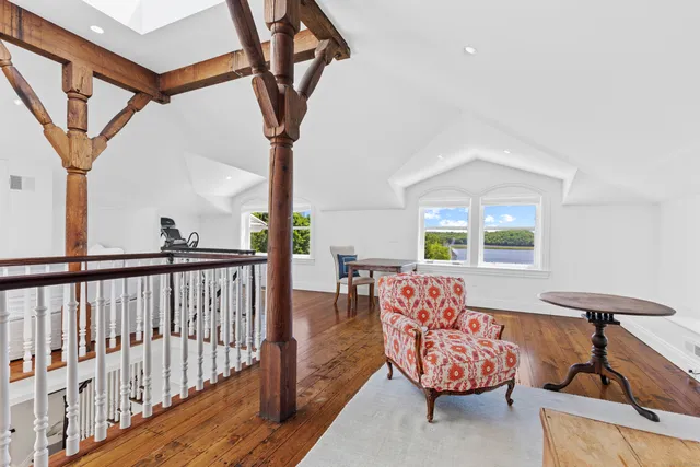 a bathroom with a double vanity sink a mirror a window and a shower