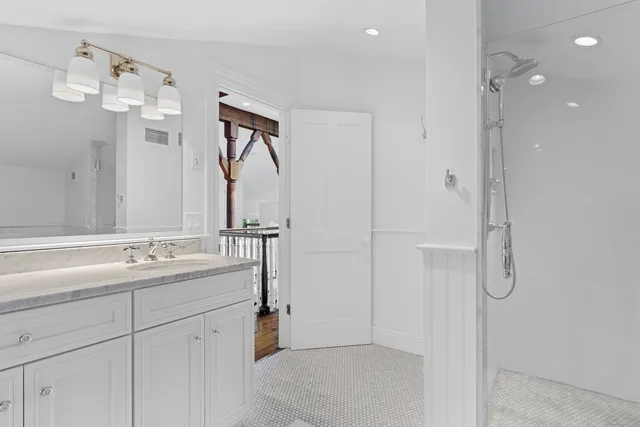 a view of a balcony with wooden floor