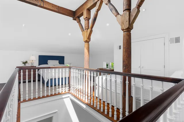 a view of a balcony with lake view and a floor to ceiling window