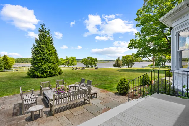 a view of a patio with a table & chairs