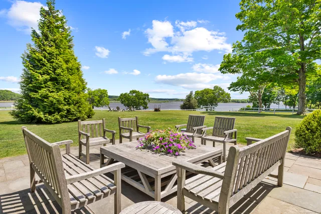 a view of a lake with houses in the back