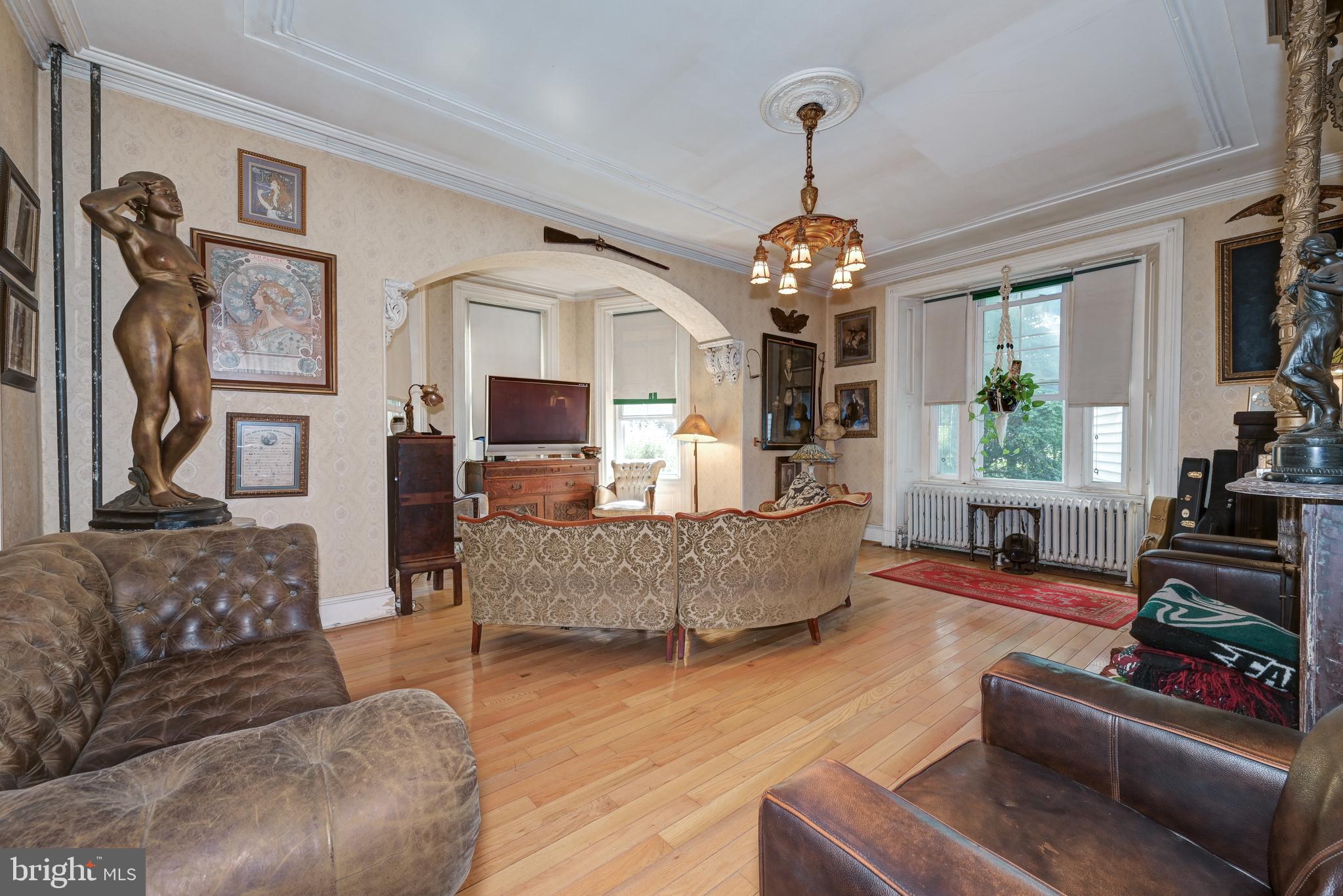705 Woodlane Road Beverly, NJ 08010 - Photo 14 of 65 a living room with furniture and a chandelier