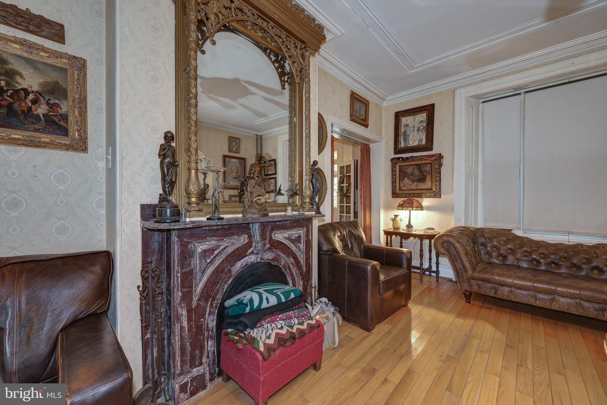 705 Woodlane Road Beverly, NJ 08010 - Photo 16 of 65 a living room with furniture and a fireplace