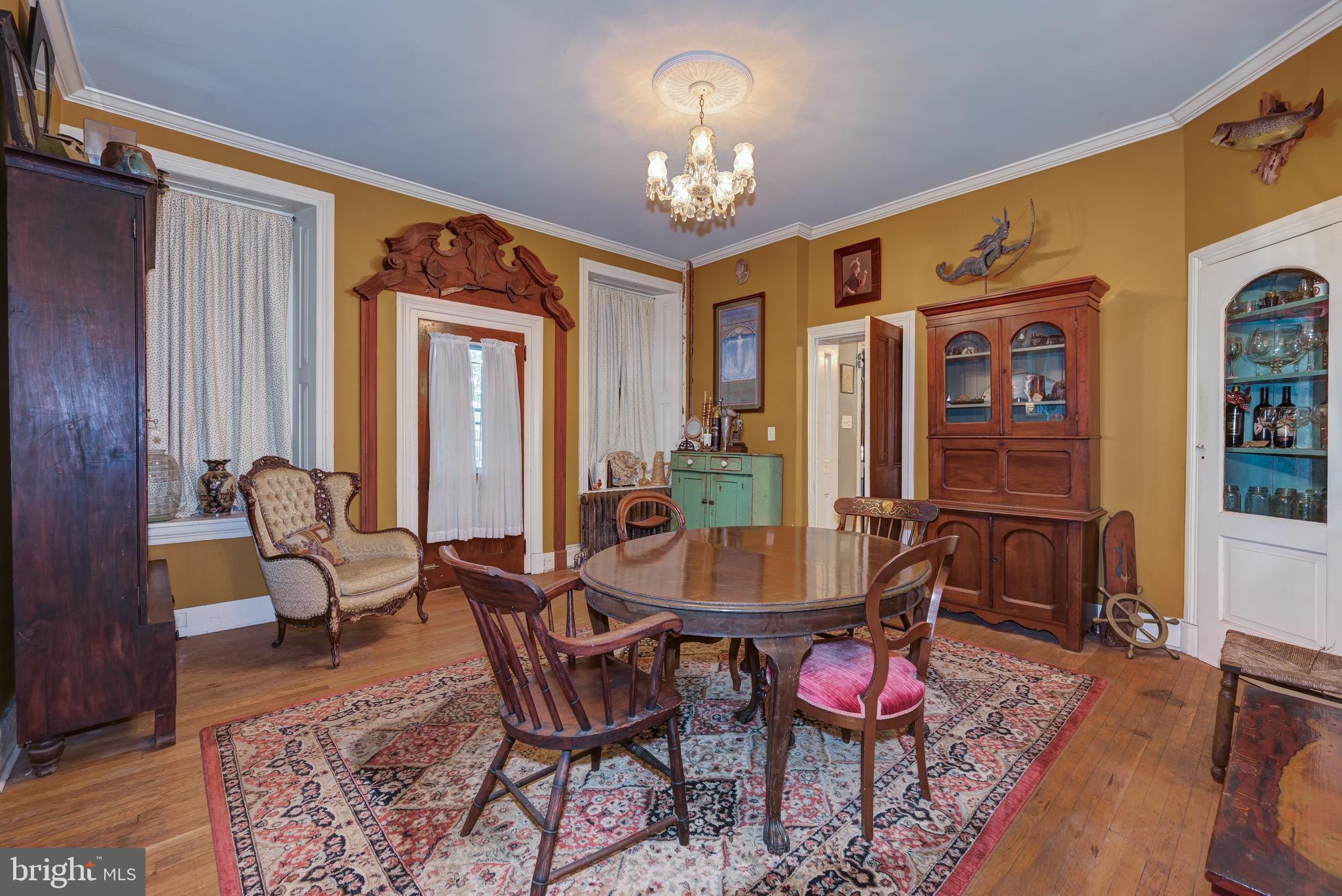 705 Woodlane Road Beverly, NJ 08010 - Photo 21 of 65 a dining room with furniture and window
