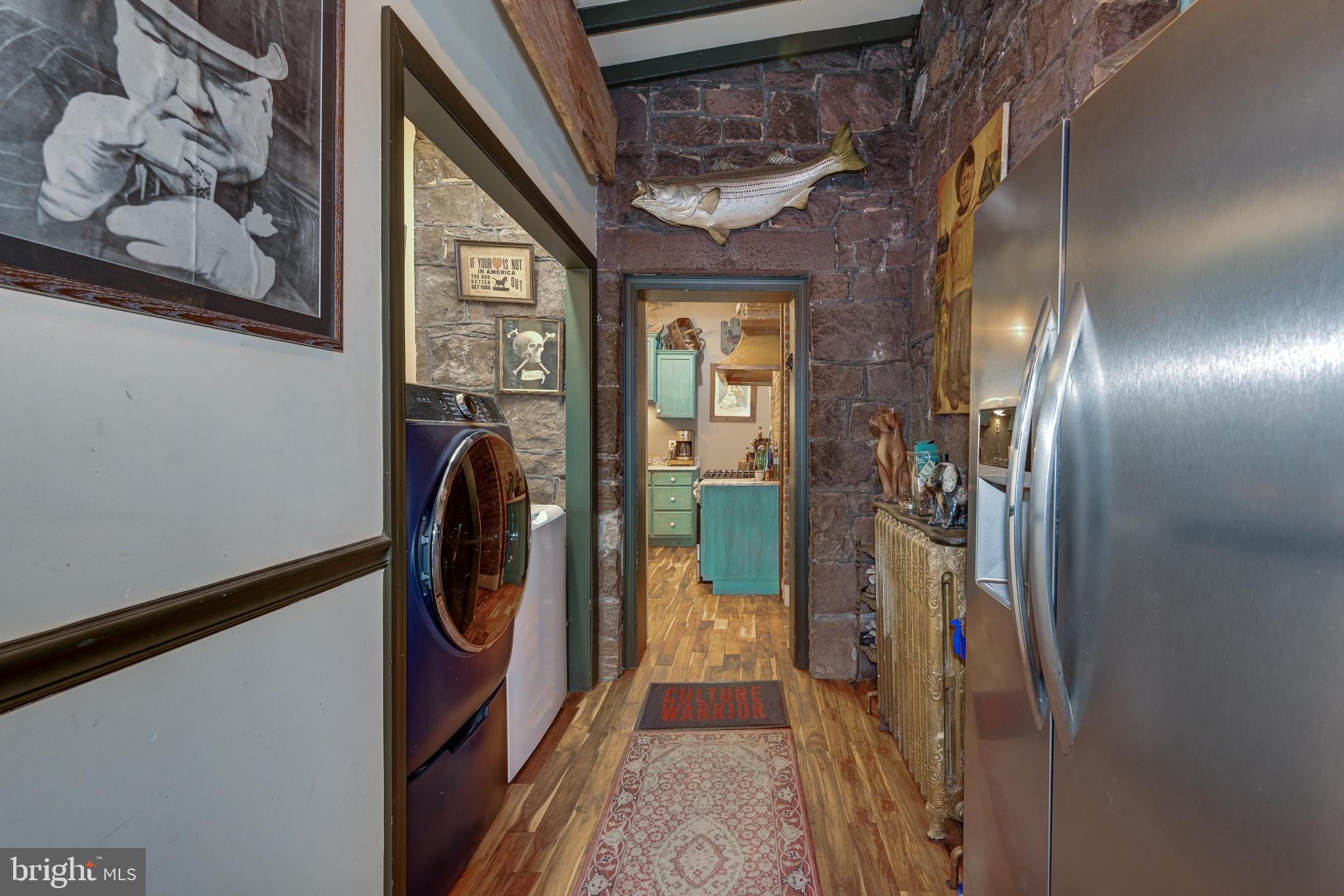 705 Woodlane Road Beverly, NJ 08010 - Photo 33 of 65 a view of a hallway with washer and dryer