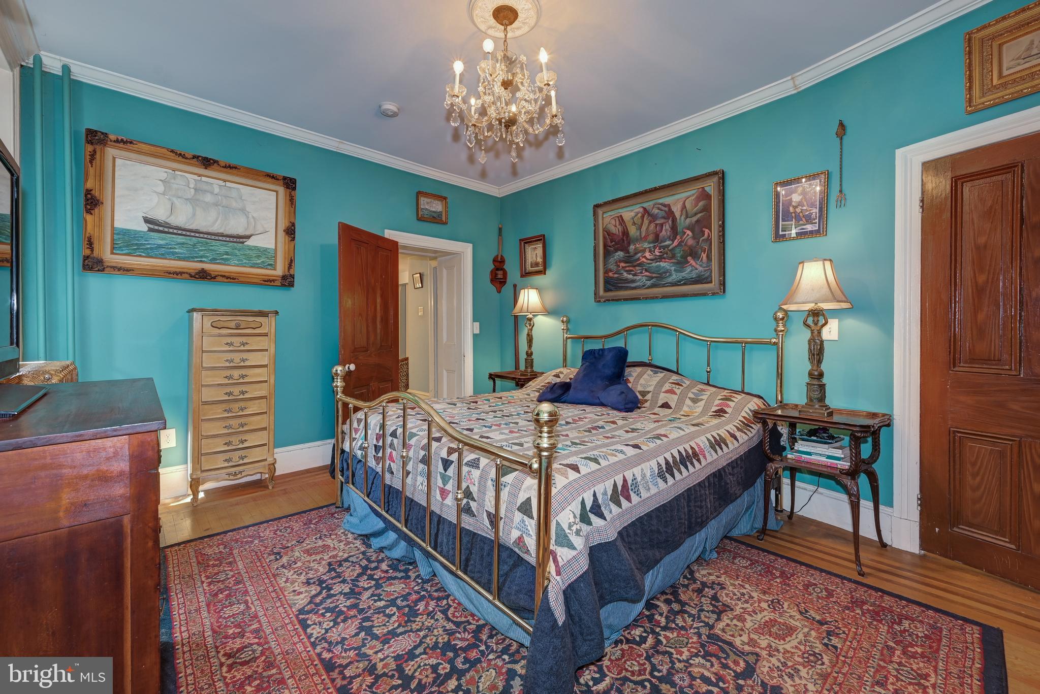 705 Woodlane Road Beverly, NJ 08010 - Photo 39 of 65 a bedroom with a bed and a table in it