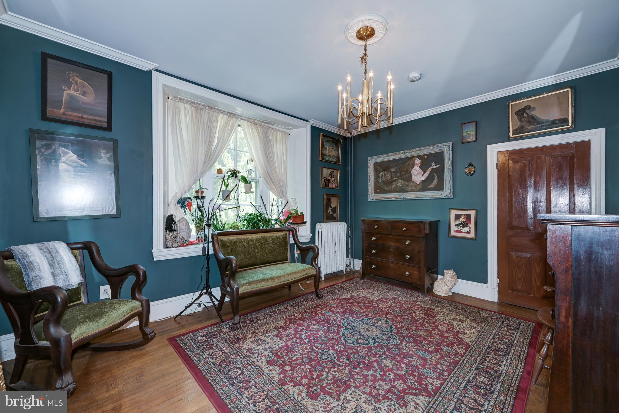 705 Woodlane Road Beverly, NJ 08010 - Photo 49 of 65 a living room with furniture and a chandelier