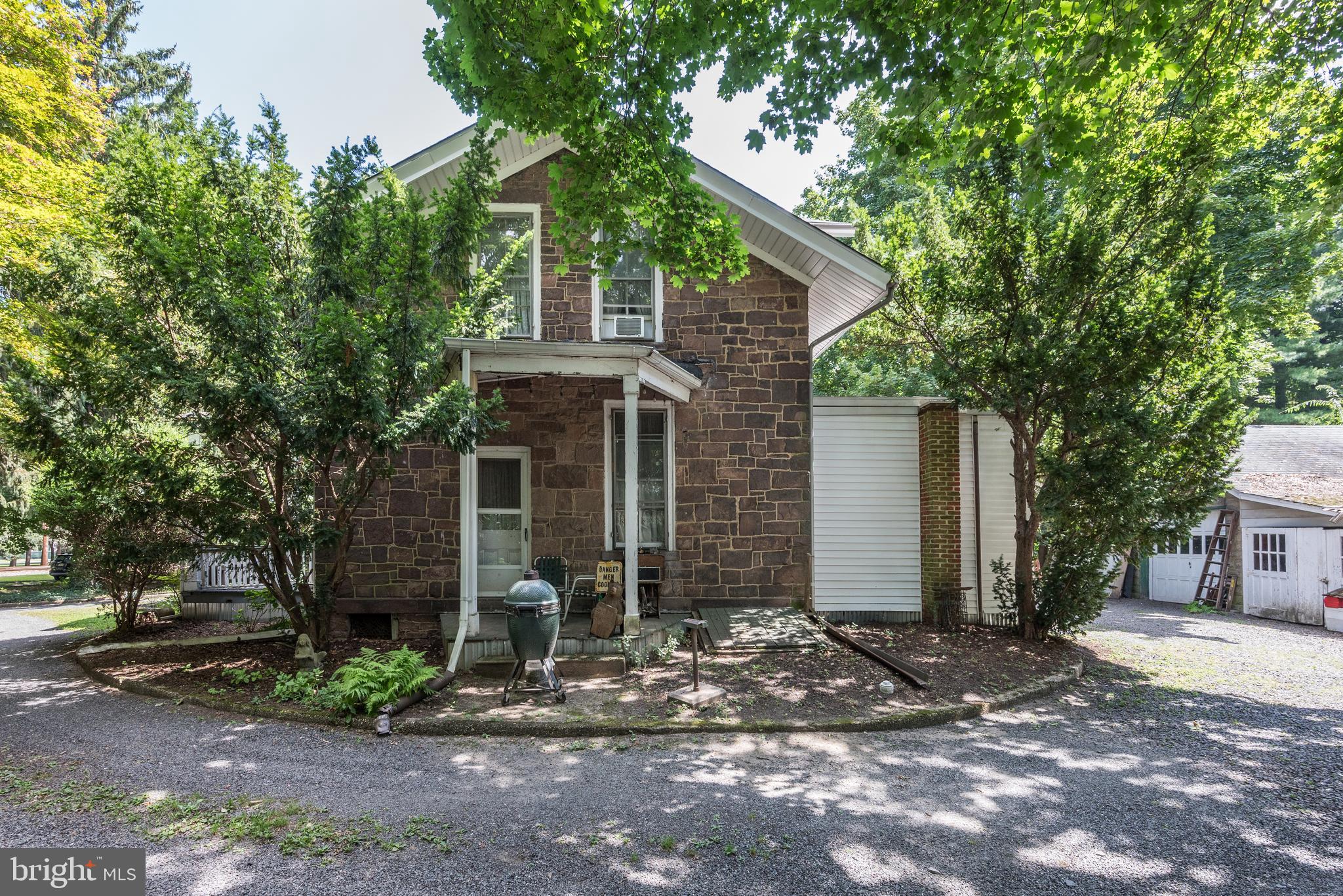 705 Woodlane Road Beverly, NJ 08010 - Photo 55 of 65 a front view of a house with garden