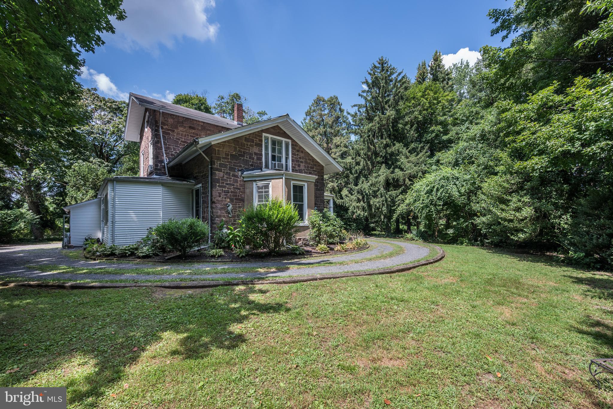 705 Woodlane Road Beverly, NJ 08010 - Photo 60 of 65 a front view of a house with a yard